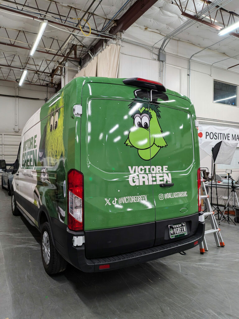 Back of Dallas Stars mascot Victor E. Green van with a custom car wrap vinyl