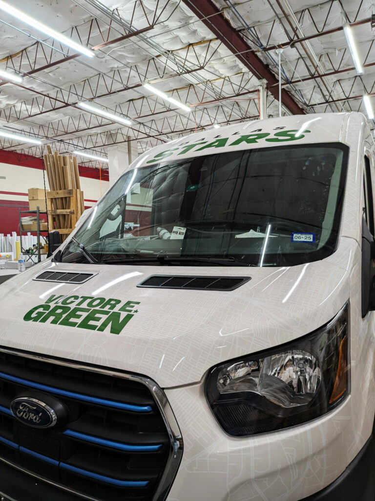 Front of Dallas Stars mascot Victor E. Green van with a custom car wrap vinyl