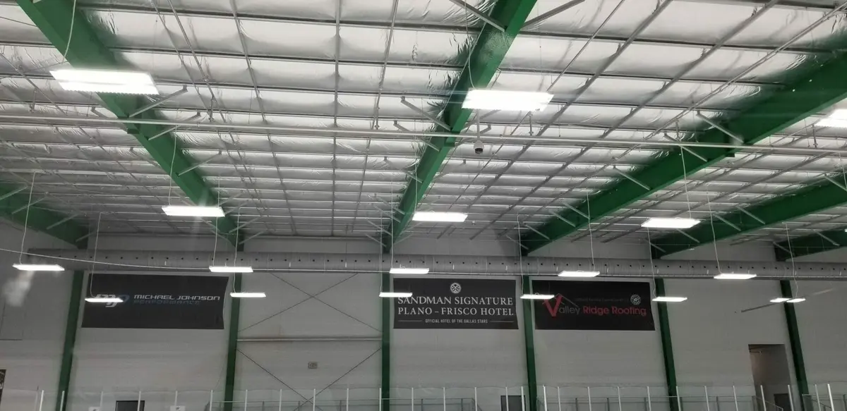 Sponsor banners printed large format hanging above a hockey rink in Dallas