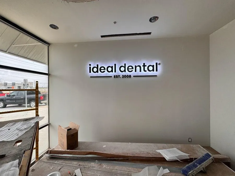 Backlit channel letter interior sign for Ideal Dental in Dallas