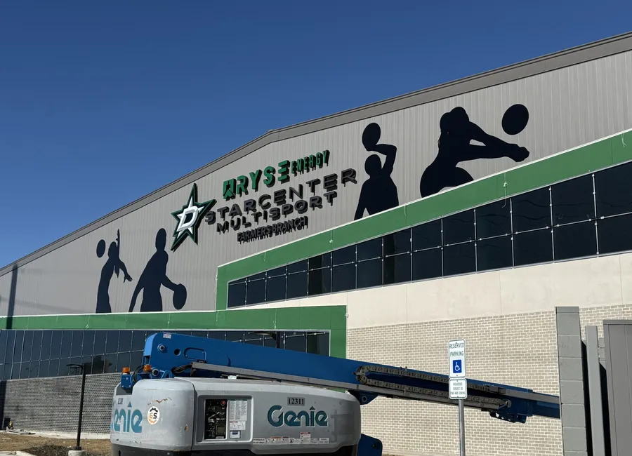 Channel letter storefront sign with dimensional star logo in daylight Dallas
