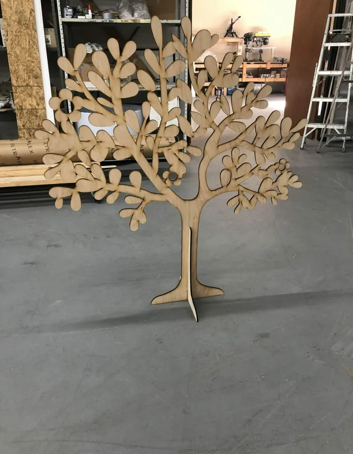 Freestanding CNC-cut wooden tree cutout fabricated in Dallas