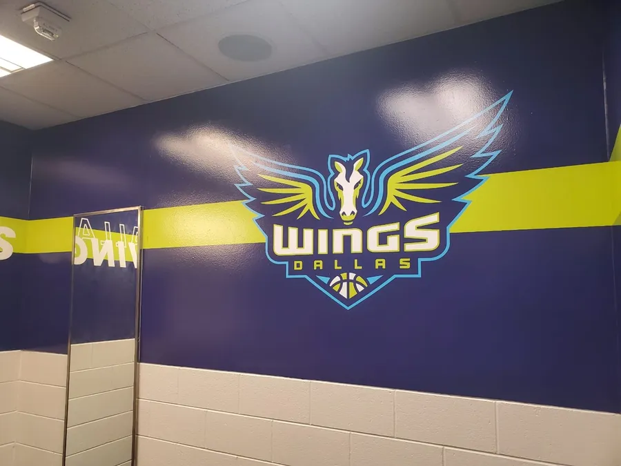 Cut vinyl wall lettering reading Whatever It Takes installed in Dallas