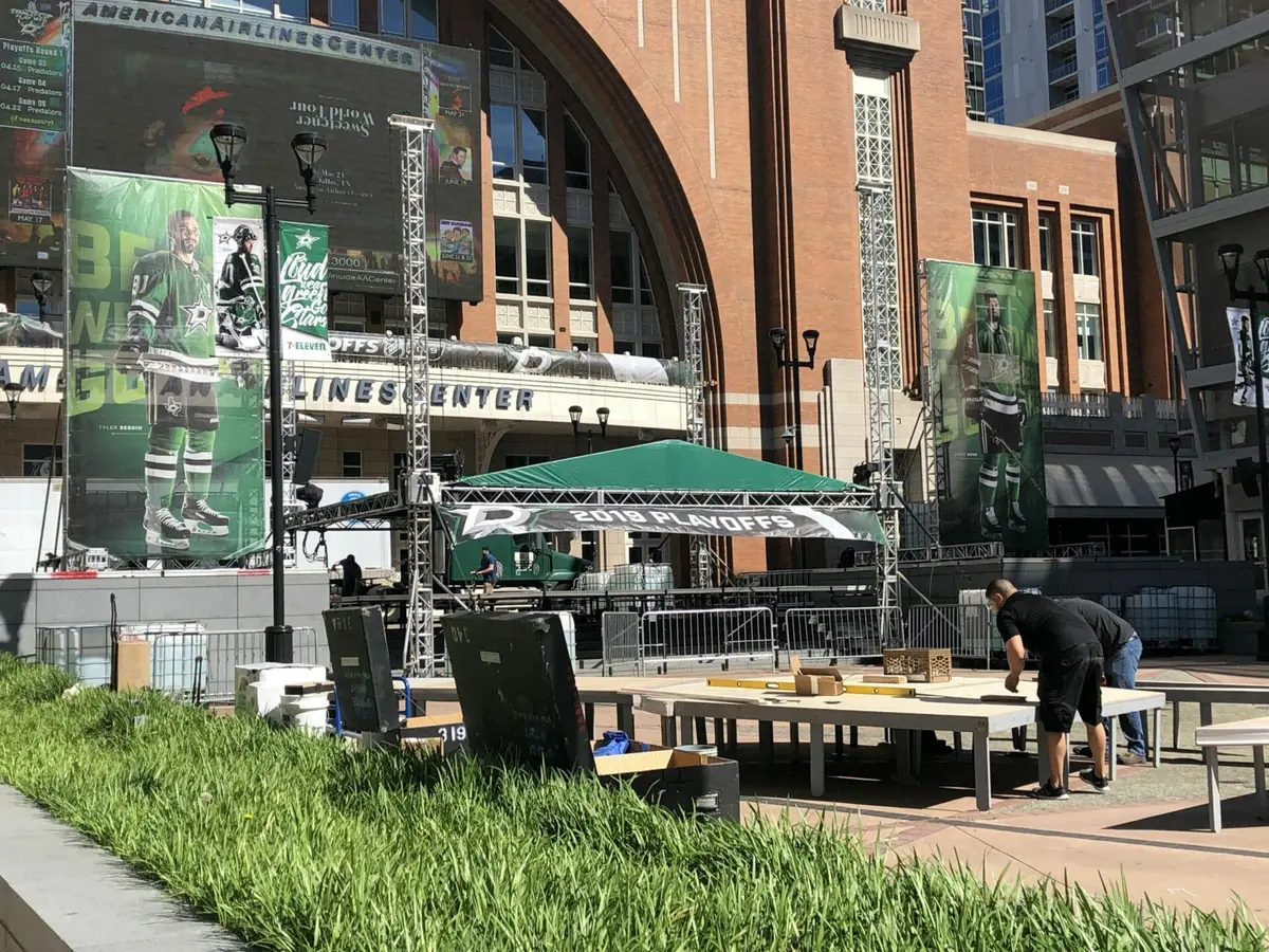 Large format event banners and stage graphics on the AAC plaza in Dallas