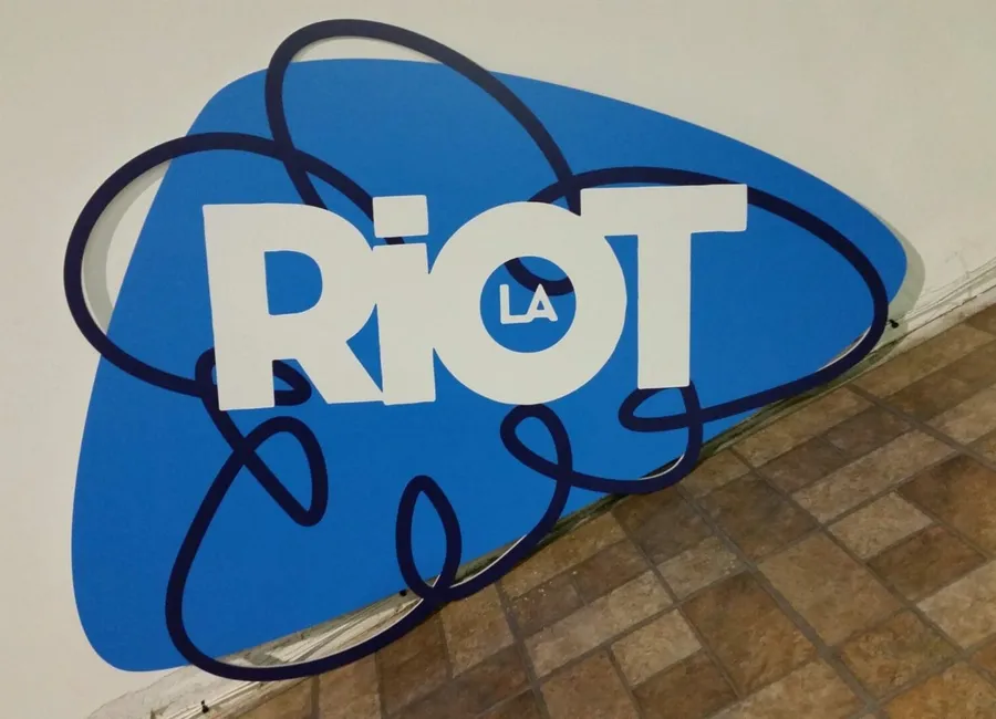 Flatbed printed dimensional RIOT LA sign mounted on a wall in Dallas