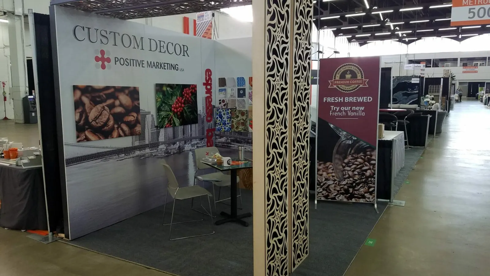 Custom Decor trade show booth with laser-cut decorative columns by Positive Marketing USA Dallas