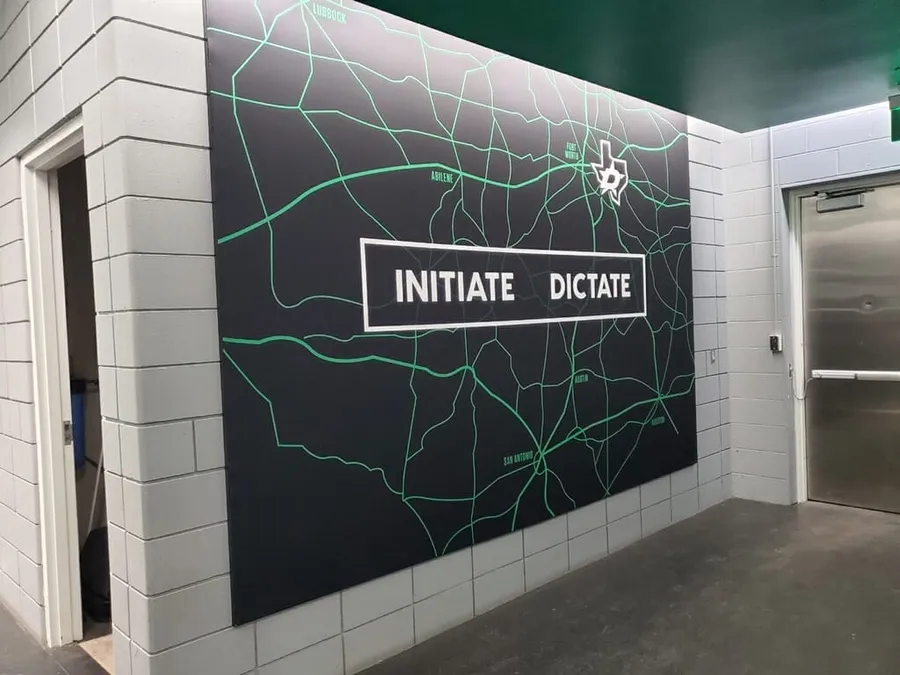 Large wall graphic with Texas map and Initiate Dictate lettering for the Dallas Stars